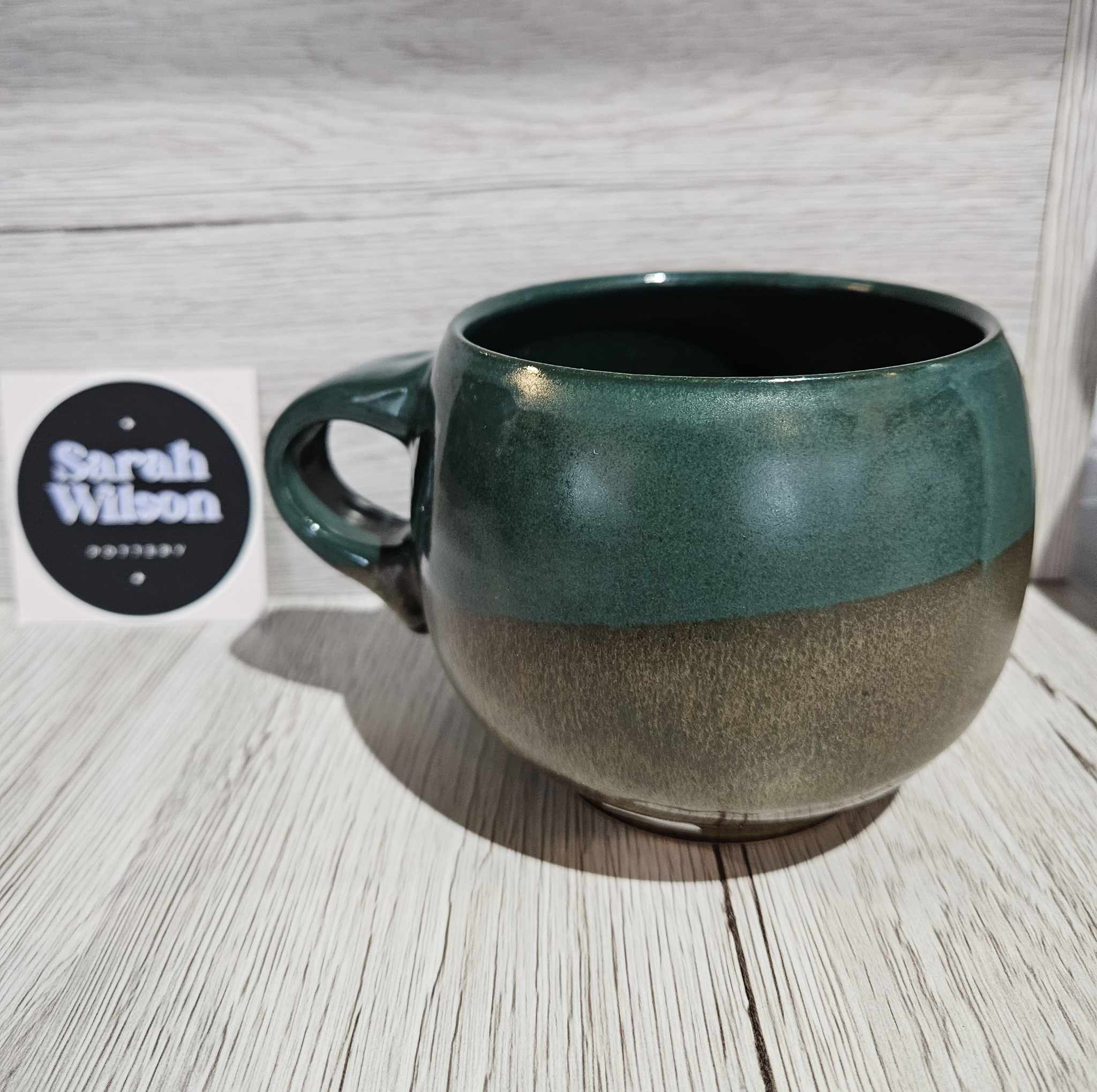 Short round green mug pottery